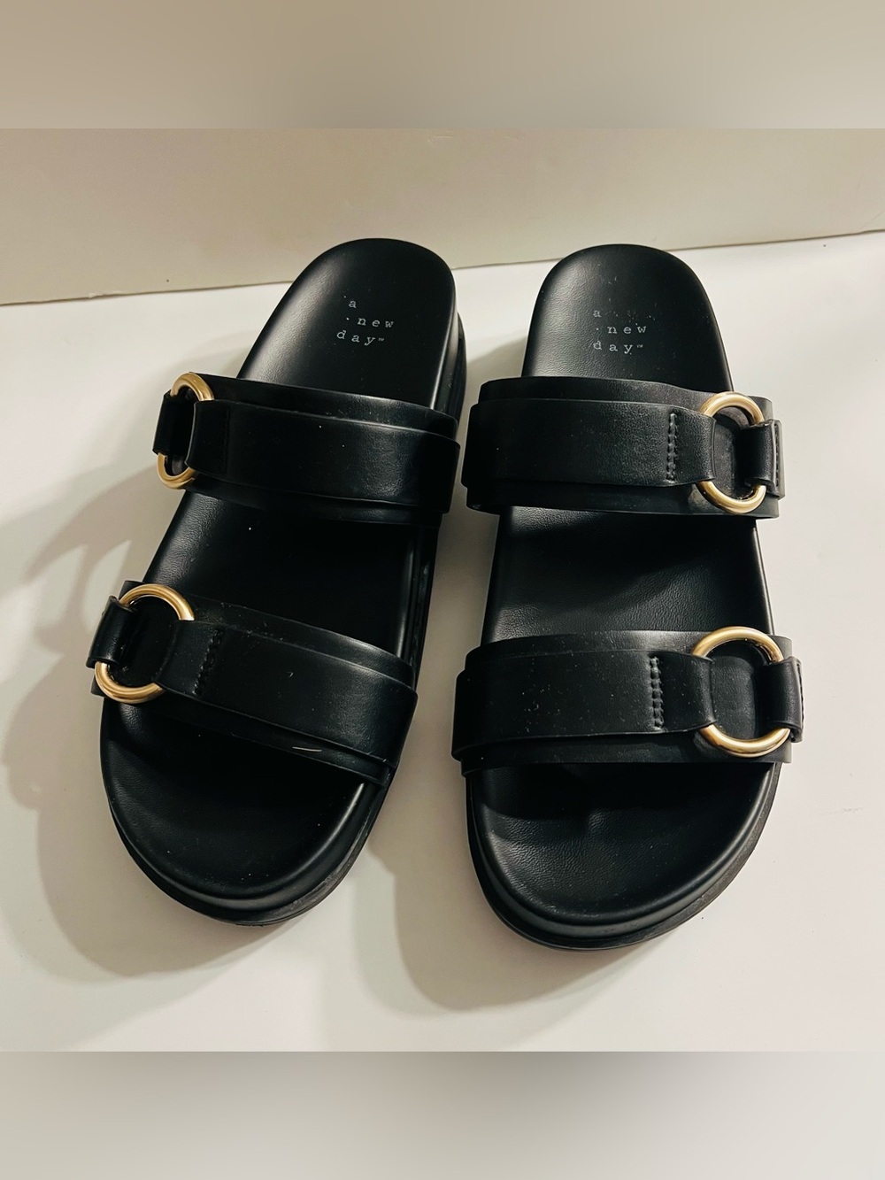 A New Day Marcy two-band buckle footbed sandals in black. Size 8